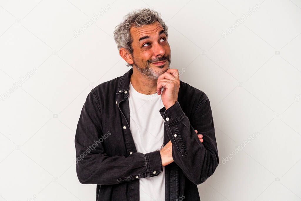 Middle age caucasian man isolated on white background  relaxed thinking about something looking at a copy space.