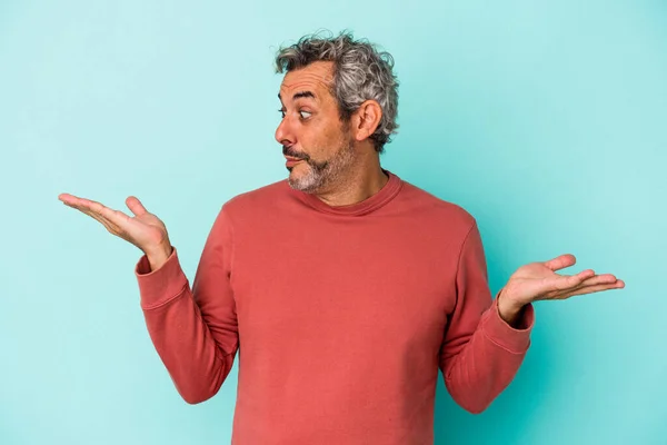 Middle Age Caucasian Man Isolated Blue Background Confused Doubtful Shrugging — Foto de Stock