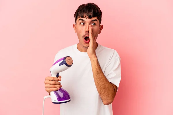 Young Mixed Race Man Holding Iron Isolated Pink Background Saying — Stock Photo, Image