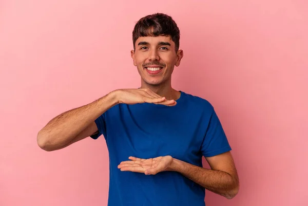 Young Mixed Race Man Isolated Pink Background Holding Something Both — Stock Photo, Image