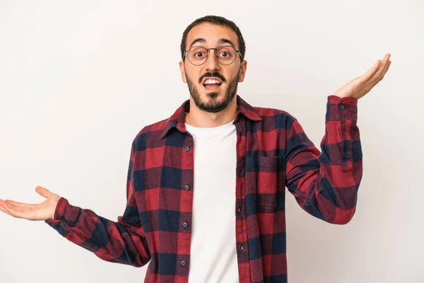 Young Caucasian Man Isolated White Background Holds Copy Space Palm — Stock Photo, Image