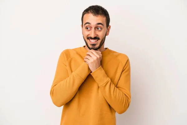 Young Caucasian Man Isolated White Background Keeps Hands Chin Looking — Stock Photo, Image