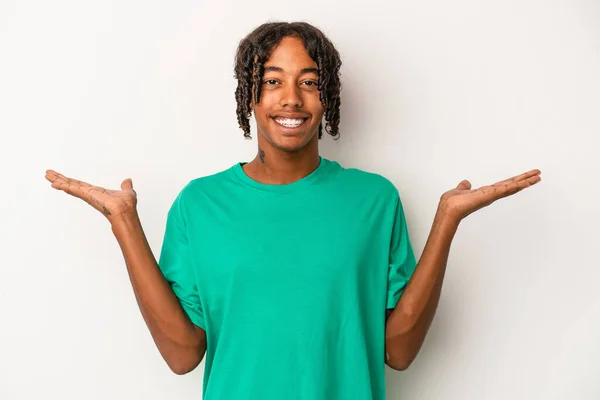 Young African American Man Isolated White Background Makes Scale Arms — Stock Photo, Image