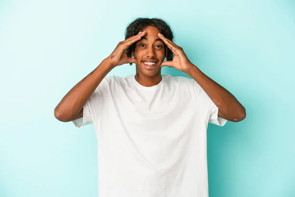 Young African American Man Isolated Blue Background Receiving Pleasant Surprise — Stock Photo, Image
