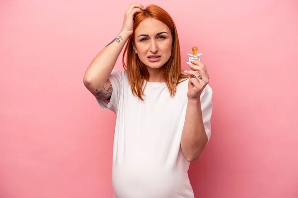 Young Caucasian Pregnant Woman Holding Pacifier Isolated Pink Background Being — Stock Photo, Image