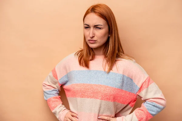 Young Caucasian Woman Isolated Beige Background Frowning Face Displeasure Keeps — Stock Photo, Image