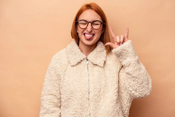 Young Caucasian Woman Isolated Beige Background Showing Rock Gesture Fingers — Stock Photo, Image