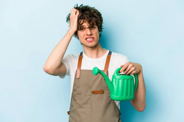 Young Gardener Caucasian Man Holding Watering Can Isolated Blue Background — 스톡 사진