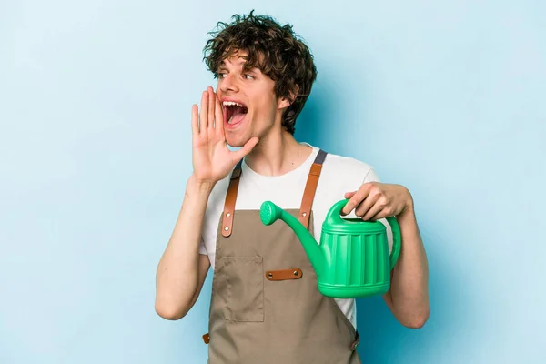 Young Gardener Caucasian Man Holding Watering Can Isolated Blue Background — 스톡 사진