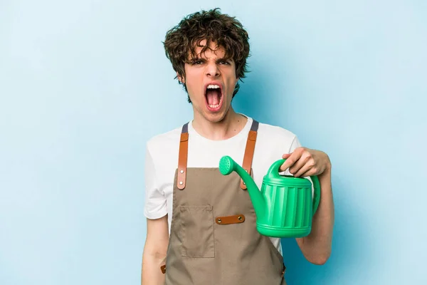 Young Gardener Caucasian Man Holding Watering Can Isolated Blue Background — 스톡 사진