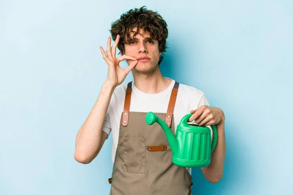 Young Gardener Caucasian Man Holding Watering Can Isolated Blue Background — 스톡 사진