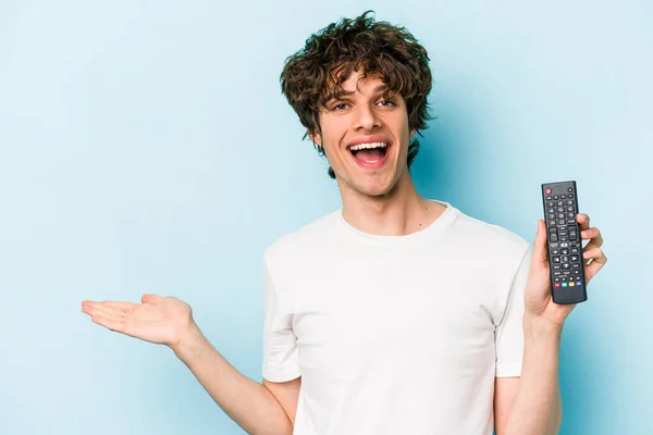 Young Caucasian Man Holding Controller Isolated Blue Background Showing Copy — 스톡 사진