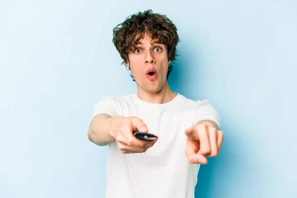 Young Caucasian Man Holding Controller Isolated Blue Background — Fotografia de Stock