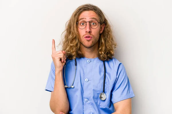 Young Nurse Caucasian Man Isolated Blue Background Having Some Great — Stock Photo, Image