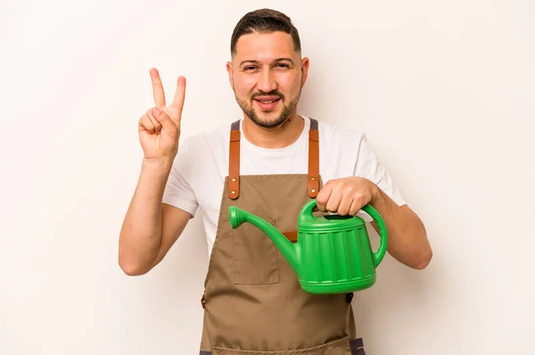 Gardener Hispanic Man Holding Watering Can Isolated White Background Showing — Foto Stock
