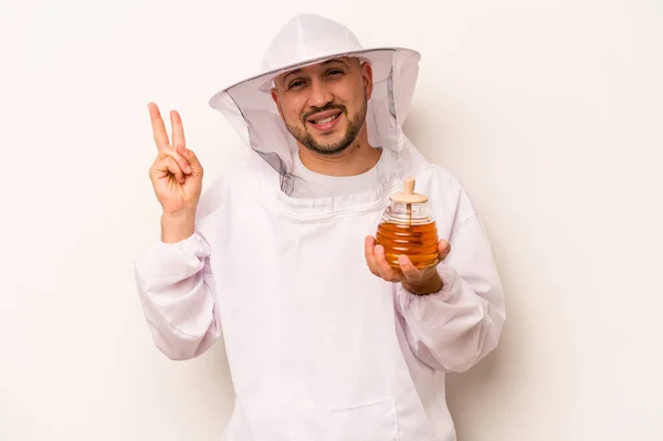 Hispanic Beekeeper Man Holding Honey Isolated White Background Joyful Carefree — Foto Stock