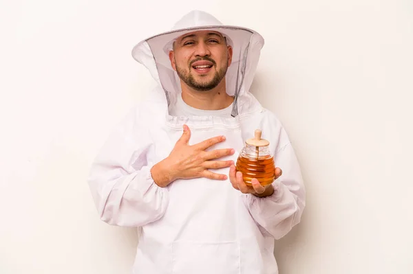 Hispanic Beekeeper Man Holding Honey Isolated White Background Laughs Out — Photo