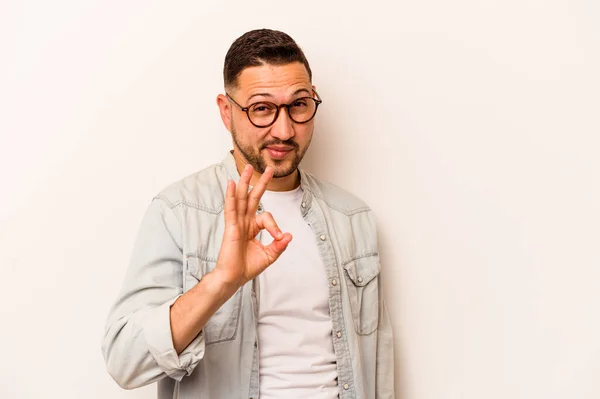 Young Hispanic Man Isolated White Background Winks Eye Holds Okay — ストック写真