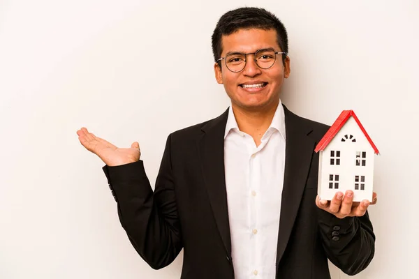 Young Business Hispanic Man Holding Little House Isolated White Background — Stock Photo, Image