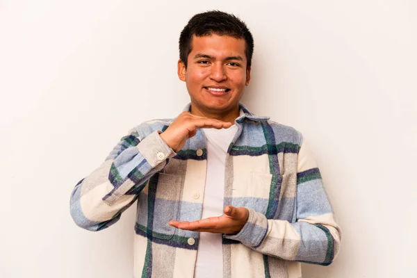 Young Hispanic Man Isolated White Background Holding Something Both Hands — стоковое фото