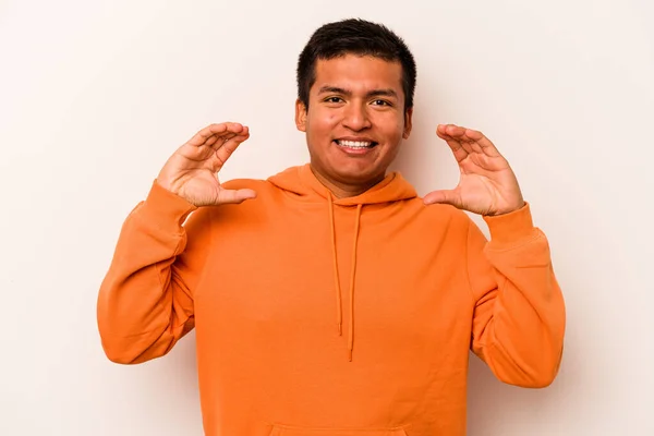 Young Hispanic Man Isolated White Background Holding Something Palms Offering — стоковое фото