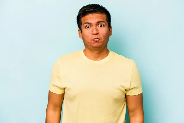 Young Hispanic Man Isolated Blue Background Shrugs Shoulders Open Eyes — Stock Photo, Image