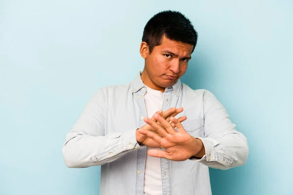 Young Hispanic Man Isolated Blue Background Doing Denial Gesture — стоковое фото