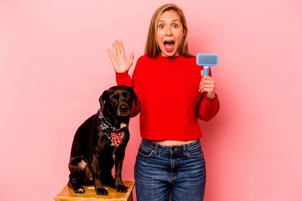 Young Caucasian Woman Combing Dog Isolated Pink Background Surprised Shocked — Foto de Stock