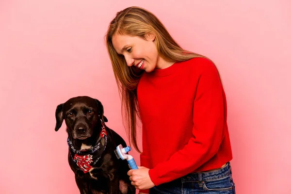 Young Caucasian Woman Combing Dog Isolated Pink Background — Fotografia de Stock