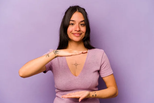 Young Hispanic Woman Isolated Purple Background Holding Something Both Hands — 스톡 사진