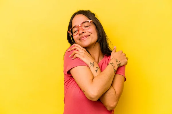 Young Hispanic Woman Isolated Yellow Background Hugs Smiling Carefree Happy — Foto Stock