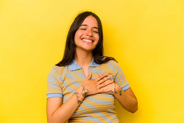 Young Hispanic Woman Isolated Yellow Background Laughing Keeping Hands Heart — Foto Stock