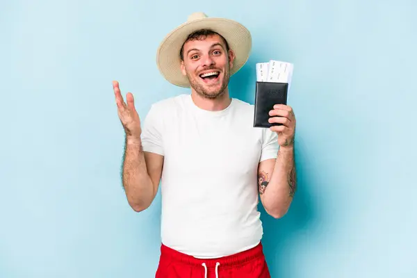 Young Caucasian Traveler Man Holding Passport Isolated Blue Background Receiving — ストック写真