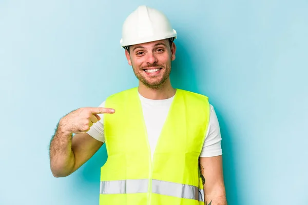 Young Laborer Caucasian Man Isolated Blue Background Person Pointing Hand — 스톡 사진