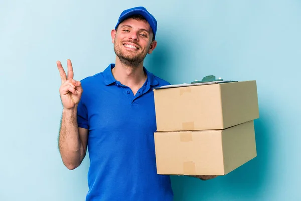 Young Caucasian Delivery Man Isolated Blue Background Joyful Carefree Showing — Stockfoto