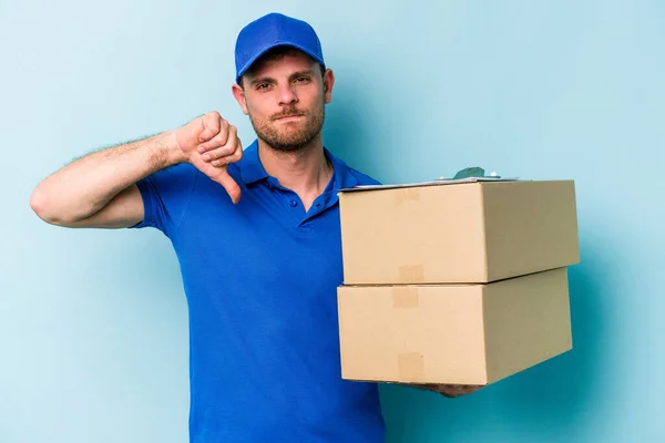 Young Caucasian Delivery Man Isolated Blue Background Showing Dislike Gesture — Stockfoto