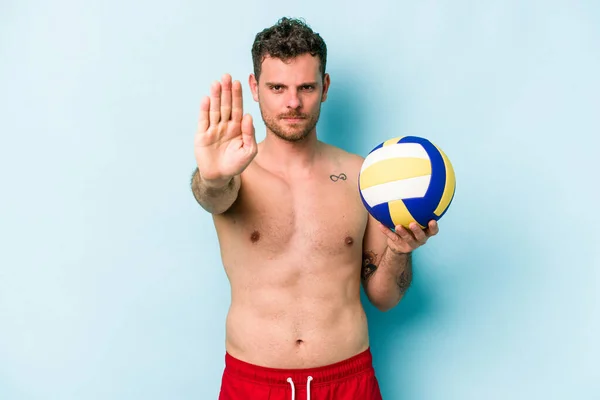Young Caucasian Man Playing Volley Isolated Blue Background Standing Outstretched — Stok fotoğraf