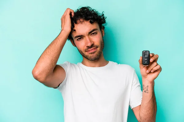 Young Caucasian Man Holding Car Keys Isolated Blue Background Being — Stockfoto