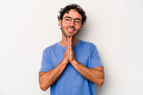 Young Caucasian Man Isolated White Background Holding Hands Pray Mouth — Stock Photo, Image