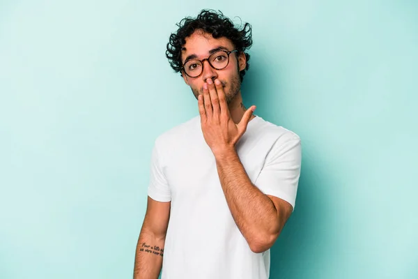 stock image Young caucasian man isolated on white background shocked, covering mouth with hands, anxious to discover something new.