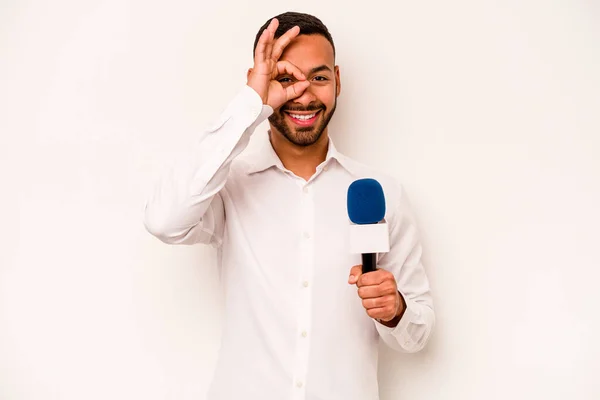 Young Hispanic Presenter Isolated Blue Background Excited Keeping Gesture Eye — Stockfoto