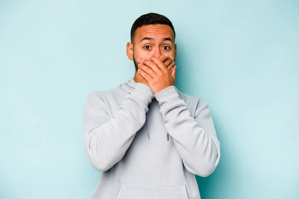 Young Hispanic Man Isolated Blue Background Shocked Covering Mouth Hands — 스톡 사진