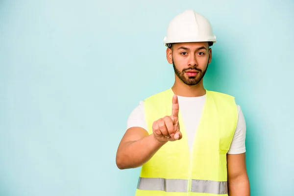Young Laborer Hispanic Man Isolated Blue Background Showing Number One — Stock Photo, Image