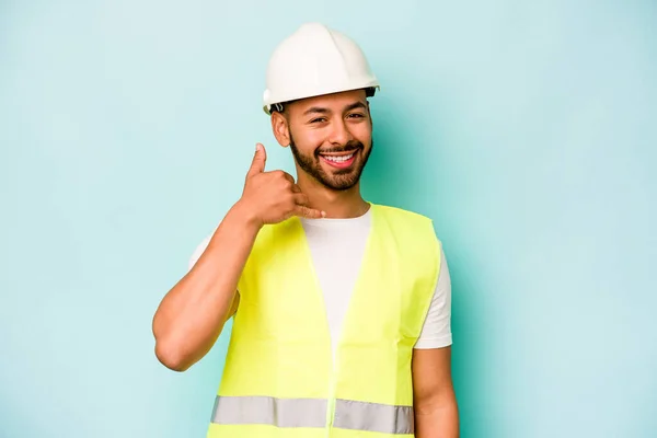 Young Laborer Hispanic Man Isolated Blue Background Showing Mobile Phone — 스톡 사진