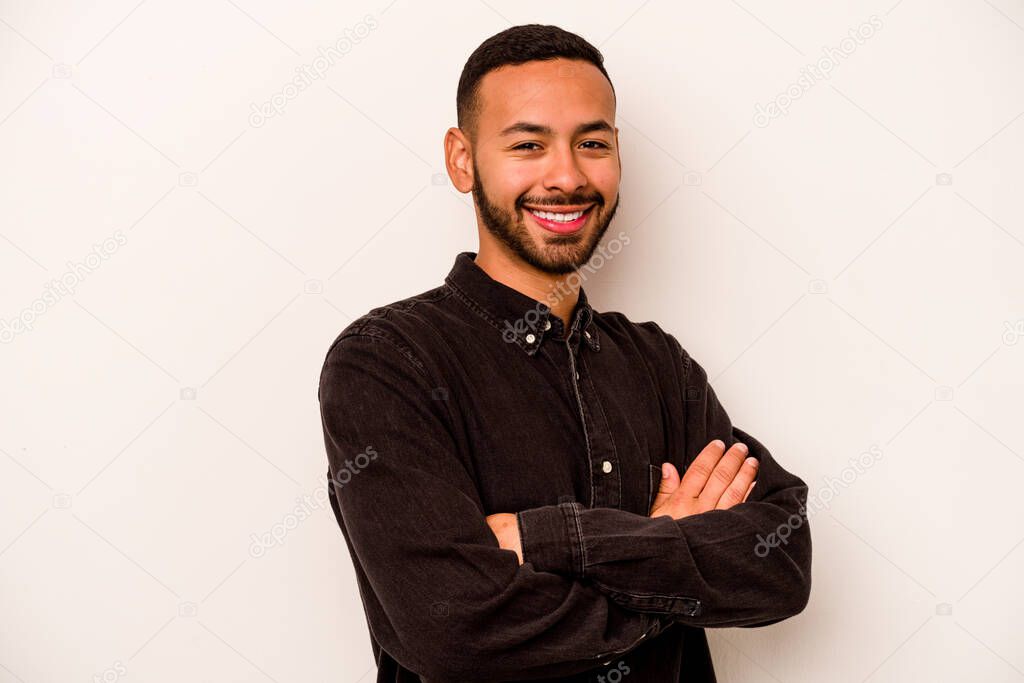 Young hispanic man isolated on white background happy, smiling and cheerful.