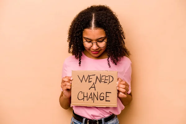 Young African American Woman Holding Need Change Placard Isolated Beige — Stok fotoğraf