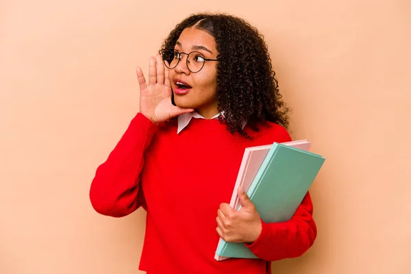 Young Student African American Woman Isolated Beige Background Shouting Holding — Stock Photo, Image