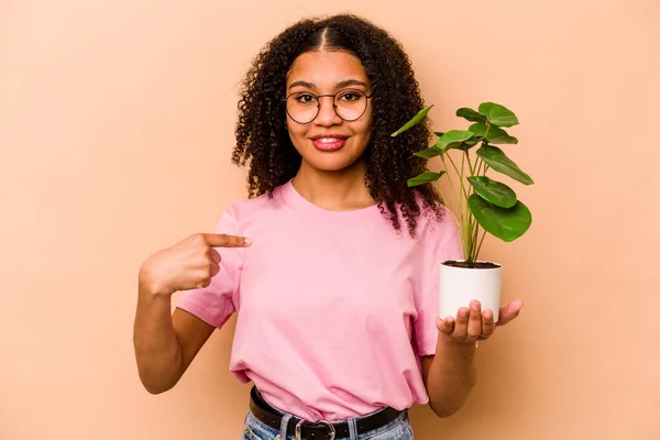 Young African American Woman Holding Plant Isolated Beige Background Person — 스톡 사진