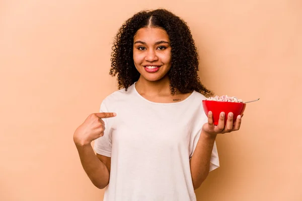 Young African American Woman Holding Bowl Cereals Isolated Beige Background — 图库照片