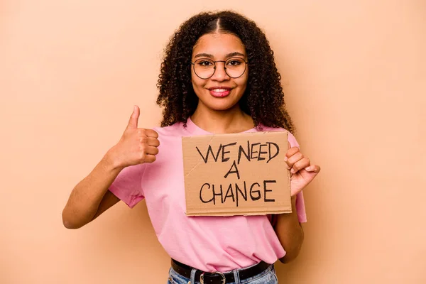 Young African American Woman Holding Need Change Placard Isolated Beige — Stok fotoğraf